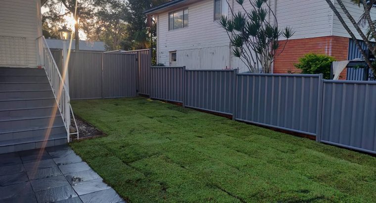 Colour bond fencing with double swinging gates and fresh new lawn